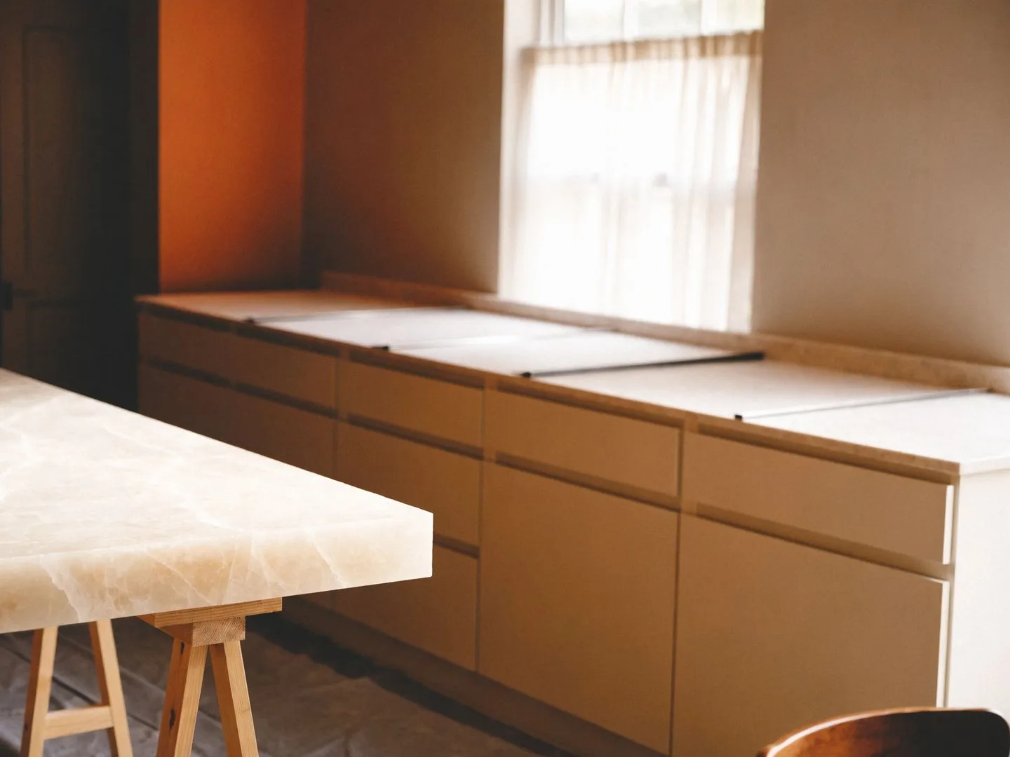 Countertop contractor in Davie, FL: a quartz slab beside a cabinet run being measured for template