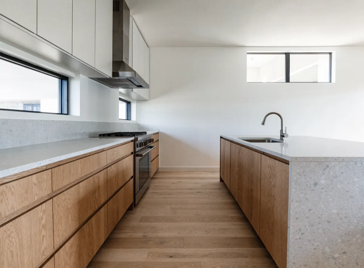 Kitchen layout redesign in Davie, FL seen along the walkway between the wall cabinets and the island