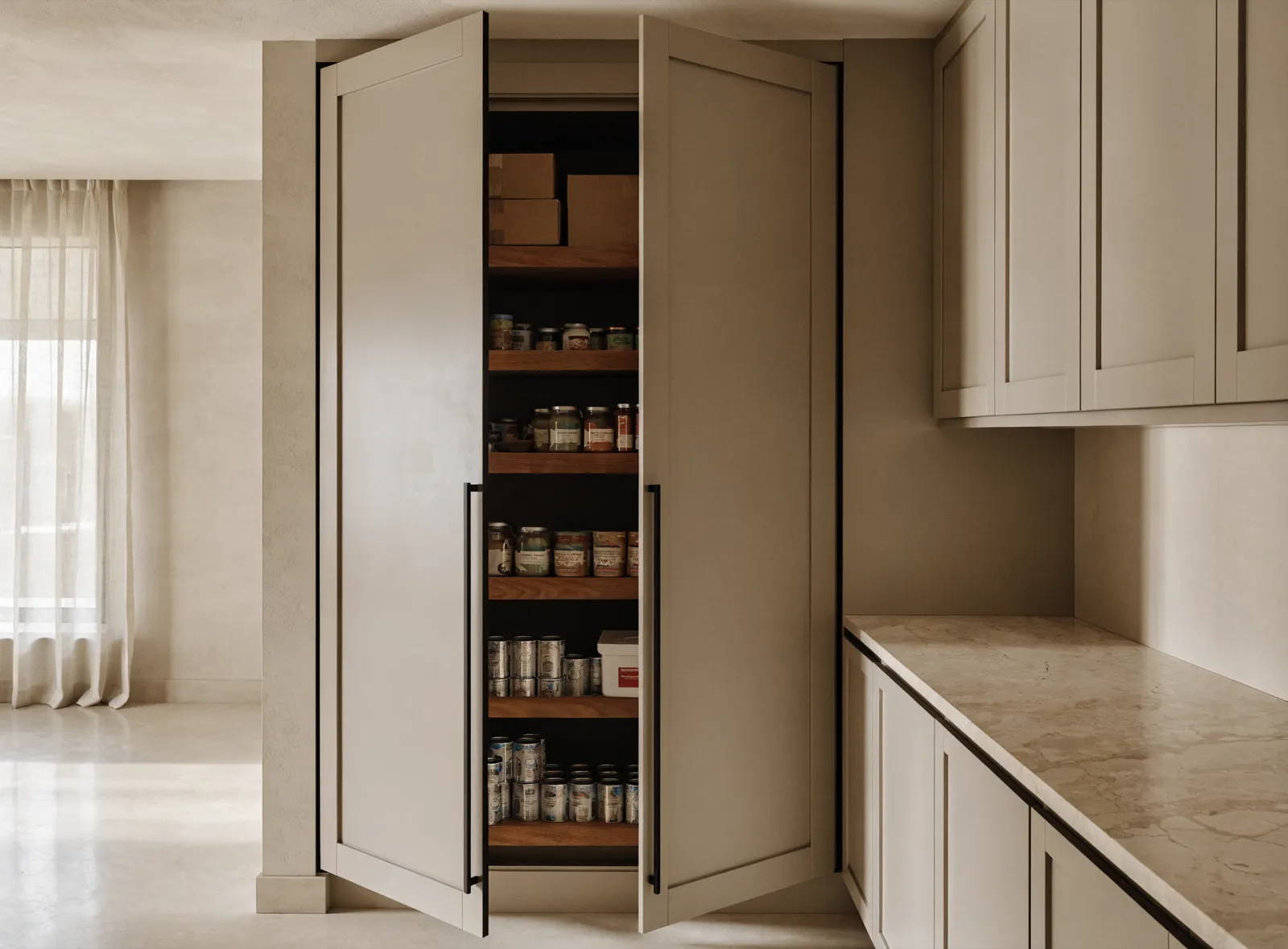 Pantry cabinets in Davie, FL: the finished floor-to-ceiling pantry with both doors open, roll-out shelves loaded with groceries and the kitchen run beside it