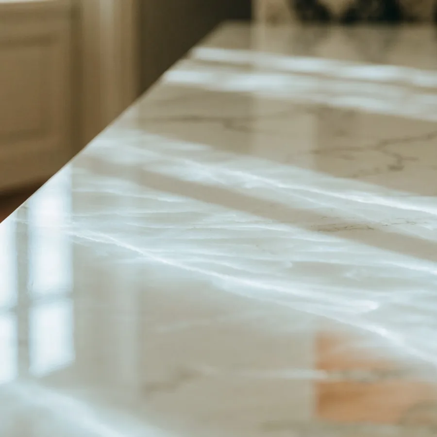 Polished quartz in a Davie kitchen, reflecting the window light across the full run